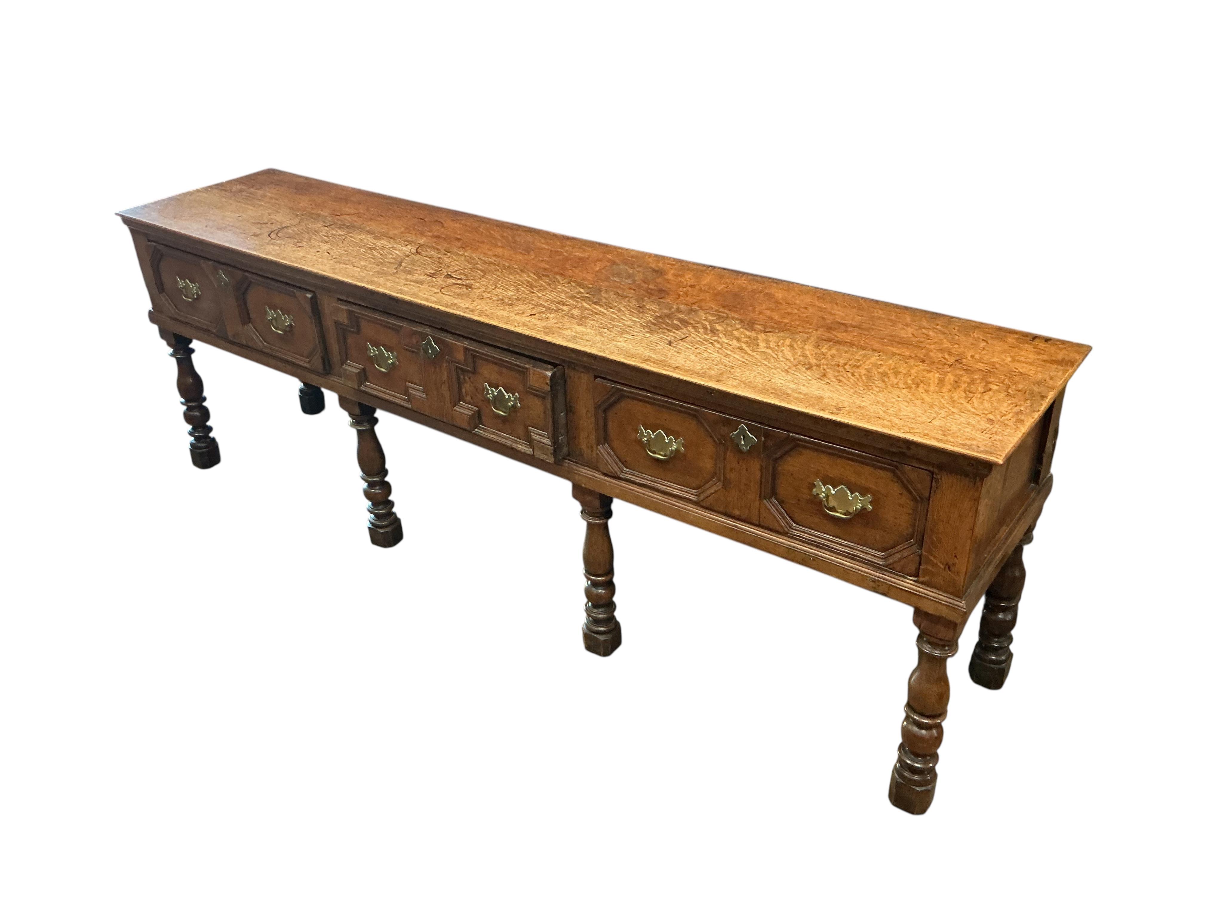 A William III and later oak low dresser, width 234cm, depth 50cm, height 78cm